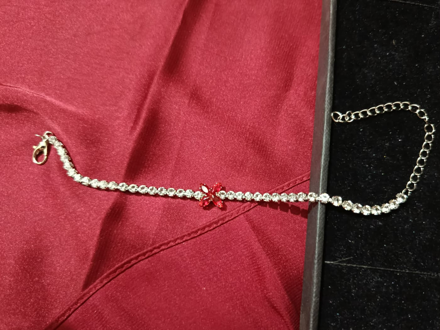 Silvery Bracelet with 4 leaf Red Charm & Full Zircon Detailing