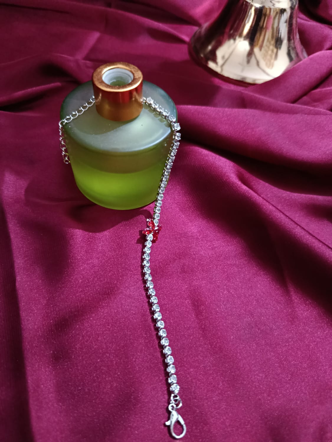 Silvery Bracelet with 4 leaf Red Charm & Full Zircon Detailing